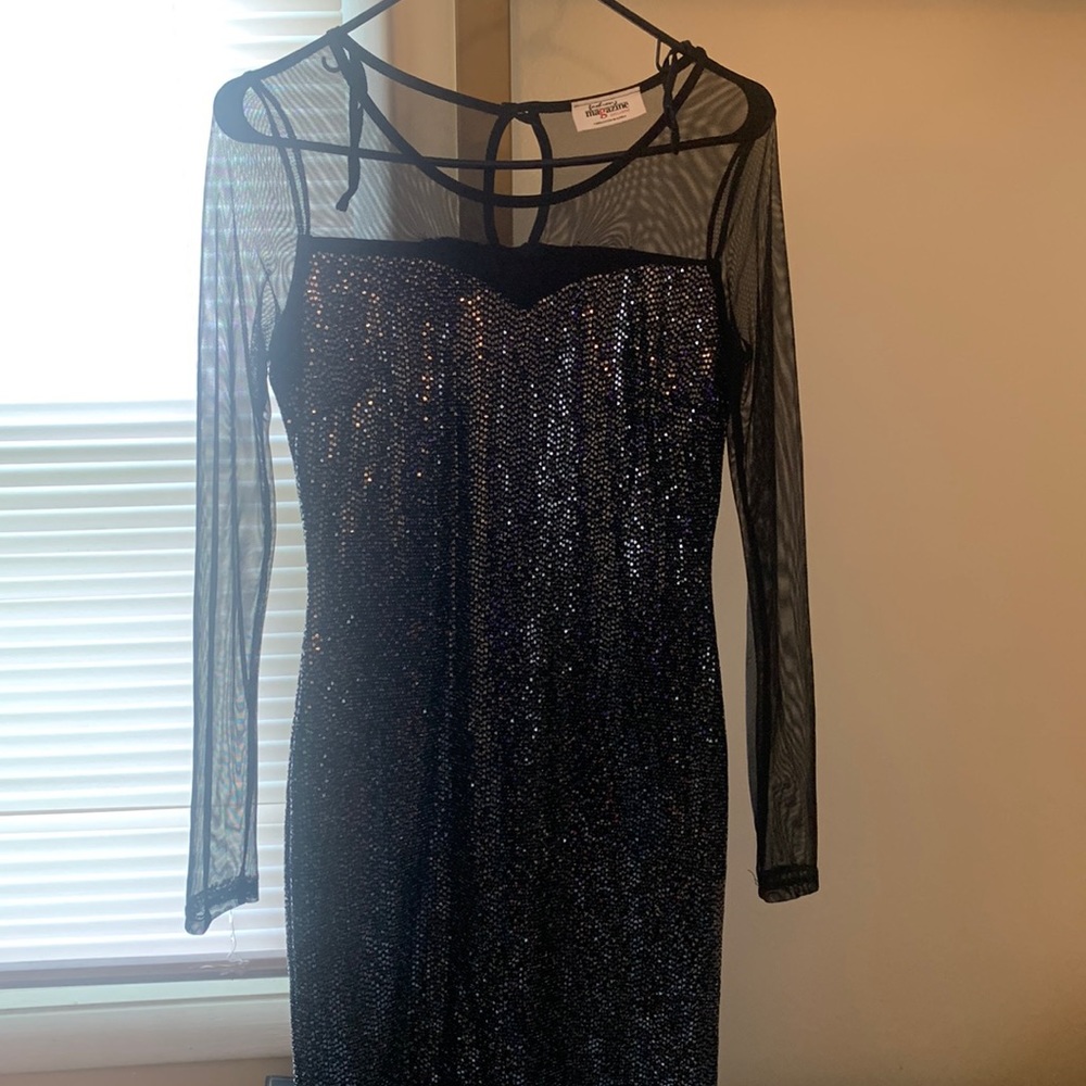 Black dress with sequence very pretty fits the body nice